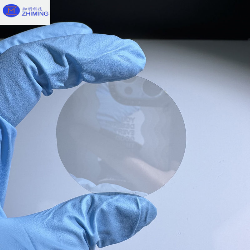 Wafer Karbida Silikon Ukuran Disesuaikan Semi isolasi Wafer SiC Hampir Tak Berwarna Transparan Tahan Tekanan Tinggi